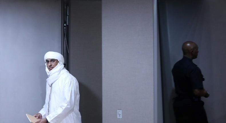 Malian jihadist Al Hassan Ag Abdoul Aziz Ag Mohamed Ag Mahmoud enters the courtroom to face charges of war crimes