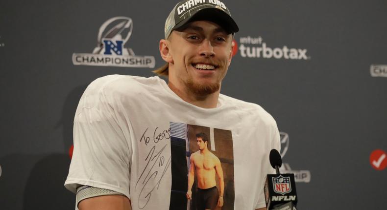 San Francisco 49ers tight end George Kittle wears a shirt showing quarterback Jimmy Garoppolo as he speaks at a news conference after the NFL NFC Championship football game against the Green Bay Packers Sunday, Jan. 19, 2020, in Santa Clara, California.