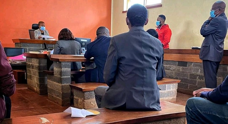 Popular blogger Edgar Obare (in red jacket) when he was presented in court