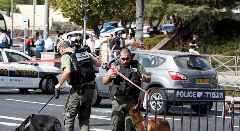 Israeli police secure the area following a shooting incident in what an Israeli police spokesperson described as a terrorist attack, near police headquarters in Jerusalem October 9, 2016. 