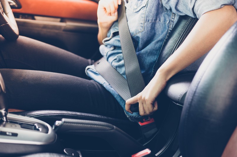 Asian,Woman,Fastening,Seat,Belt,In,The,Car,,Safety,Concept