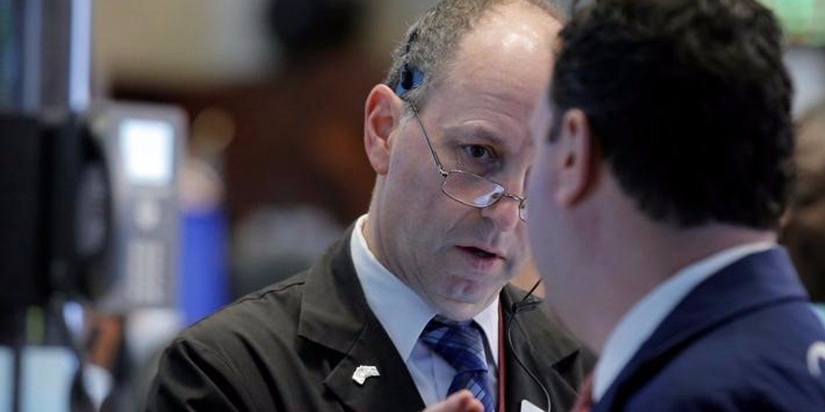 Traders work on the floor of the NYSE in New York