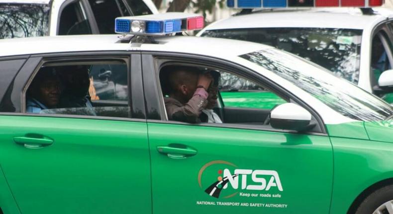 NTSA officers in a car