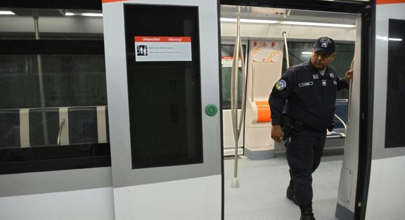 This photo shows a policeman standing guard in the new subway, which is one of the future projects Panama City removed Brazilian construction giant Odebrecht December 27, 2016, prior to creating a special office to probe the Odebrecht bribes