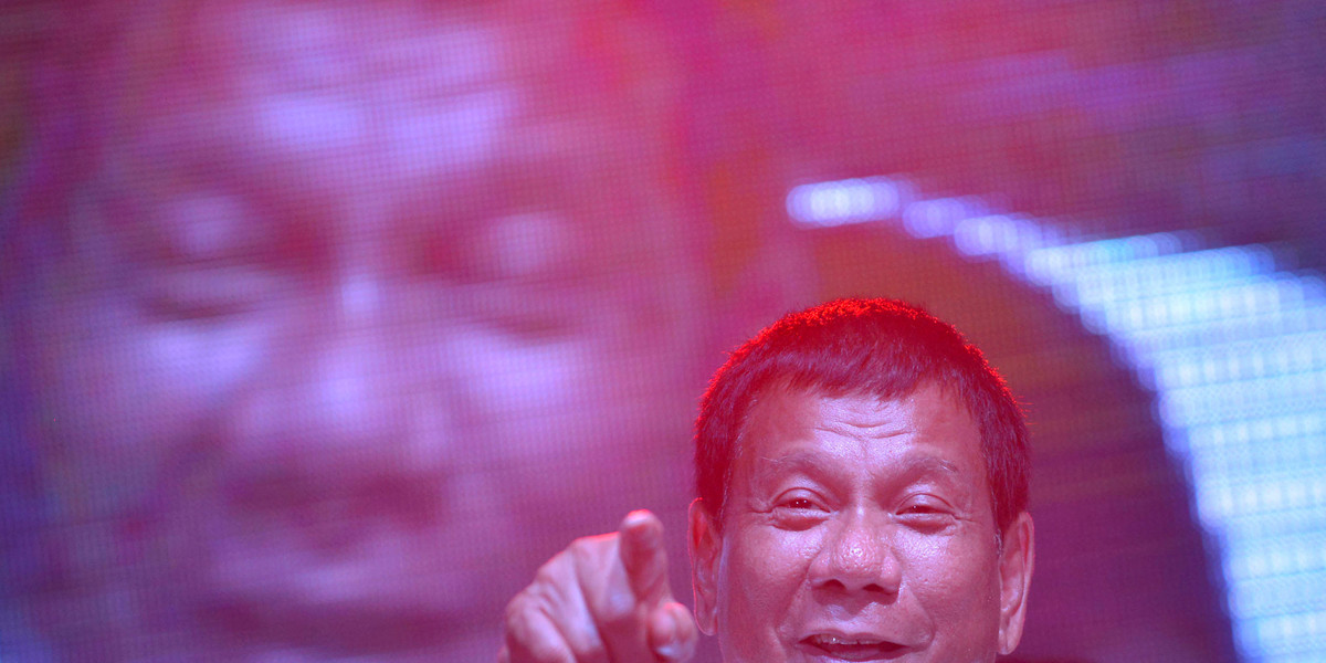 Philippine presidential candidate and Davao city mayor Rodrigo 'Digong' Duterte gestures while delivering a speech during a May Day campaign rally in Manila, Philippines May 1, 2016.