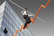 Businessman on a finance graphic aiming for the top..