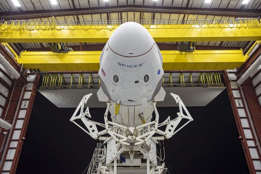 A SpaceX Falcon 9 rocket, with the Crew Dragon atop, stands poised for launch at historic Launch Com