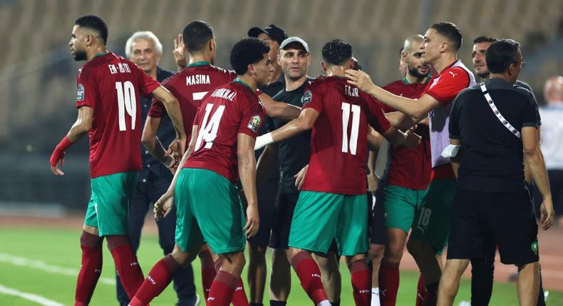 Morocco players celebrate after Zakaria Aboukhlal (C) scored their second goal against the Comoros Creator: Kenzo Tribouillard