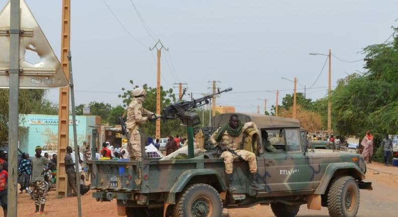Malian soldiers on patrol in the city of Gao after a deadly suicide car bomb detonated in November 2018