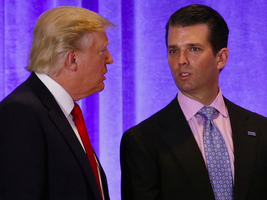 U.S. President-elect Donald Trump speaks with his son Donald Trump Jr. during a news conference in the lobby of Trump Tower in Manhattan, New York City, U.S., January 11, 2017.