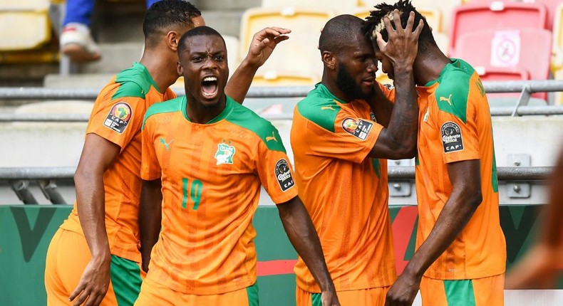 Nicolas Pepe (2nd L) and his Ivory Coast teammates celebrate after Franck Kessie put them ahead against Algeria Creator: CHARLY TRIBALLEAU