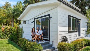 The Kantor family sits outside their completed ADU in their LA backyard.Villa