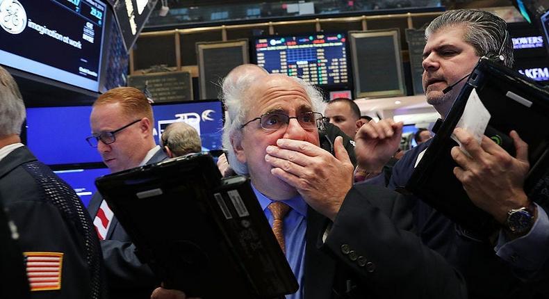 Traders work on the floor of the New York Stock Exchange (NYSE)