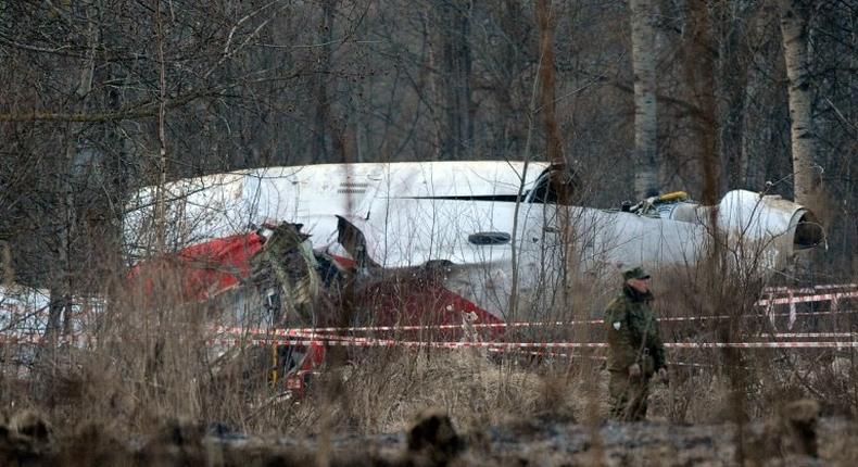 A Russian soldier stands guard on April 11, 2010 near the wreckage of a Polish government Tupolev Tu-154 aircraft which crashed on near Smolensk airport