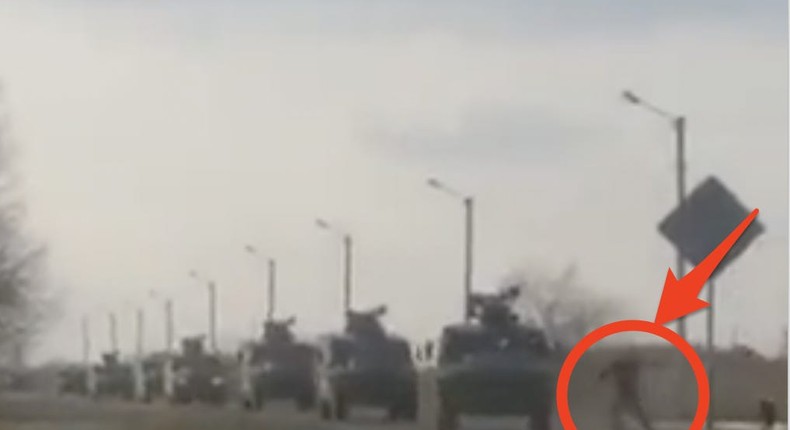 A video appears to show a Ukrainian man trying to block a Russian military convoy.