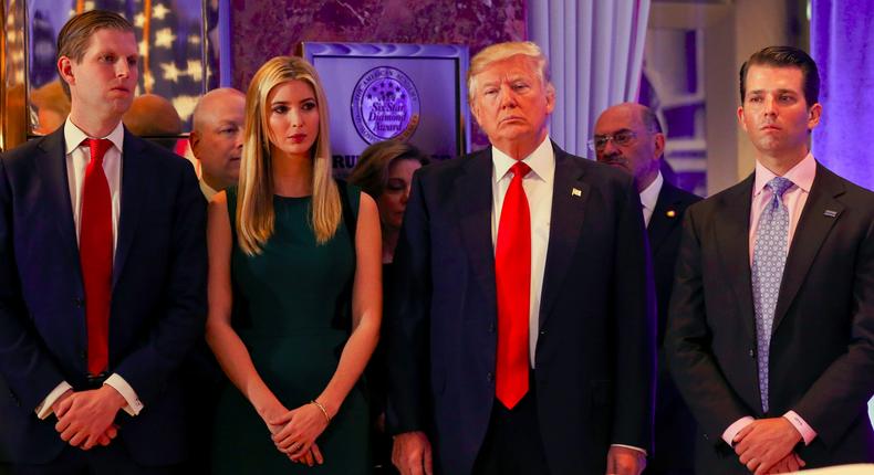 U.S. President-elect Donald Trump (C) stands surrounded by his son Eric Trump (L) daughter Ivanka and son Donald Trump Jr. (R) ahead of a press conference in Trump Tower, Manhattan, New York, U.S., January 11, 2017.