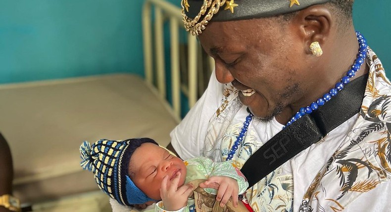 Nigerian singer Habeeb Okikiola, popularly known as Portable and his baby [Instagram/PortableDrZeh]