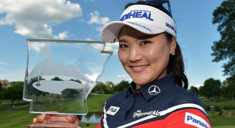 Ryu So-Yeon of South Korea celebrates with the trophy after winning the Walmart NW Arkansas Championship, at Pinnacle Country Club in Rogers, Arkansas, on June 25, 2017