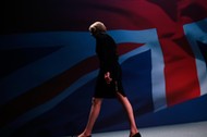 Britain's Home Secretary Theresa May leaves the stage after speaking on the third day of the Conserv