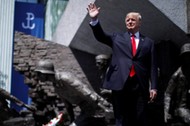 U.S. President Donald Trump waves as he arrives to hold a public speech in front of the Warsaw Upris