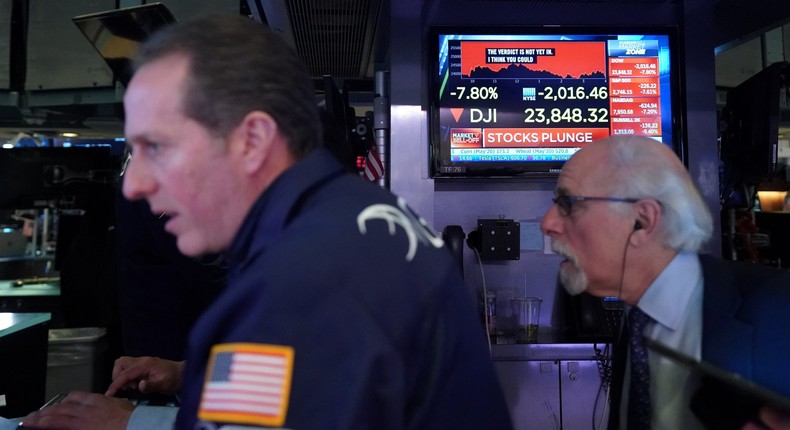 Traders work on the floor of the New York Stock Exchange (NYSE) in New York, U.S., March 9, 2020.
