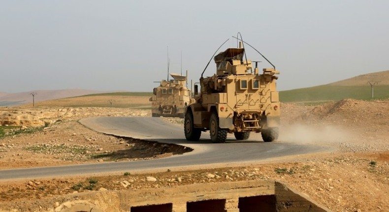 US-made armoured vehicles bearing markings of the US Marine Corps are seen on a road north of Raqa in northern Syria on March 27, 2017