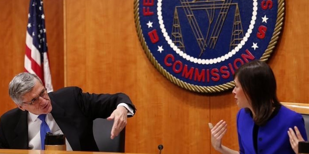 Federal Communications Commission Chairman Tom Wheeler and commissioner Jessica Rosenworcel talk at the FCC Net Neutrality hearing in Washington