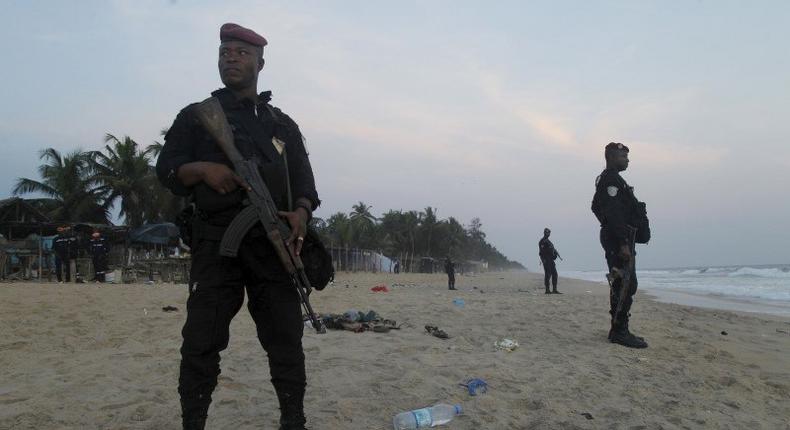 Soldiers stand in guard on the beach in Grand Bassam, Ivory Coast, March 13, 2016. REUTERS/Luc Gnago
