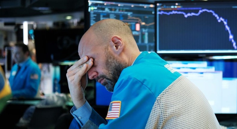 Traders work on the floor of the New York Stock Exchange (NYSE) on March 18, 202