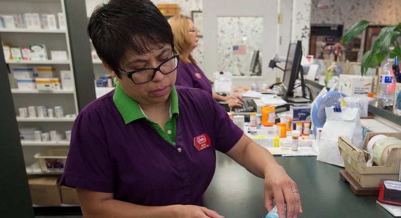 In this Friday, July 8, 2016, photo, pharmacist technician Irene Arrenquin fills a prescription for the anti-diarrhea drug diphenoxylate hydrochloride and atropine sulfate at Pucci's Pharmacy, in Sacramento, Calif. The drug is one of several that has seen a significant cost increase in recent months.