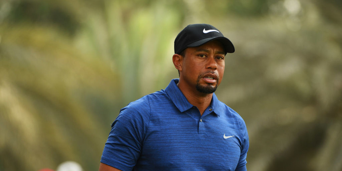 Tiger Woods withdraws from tournament due to back spasms