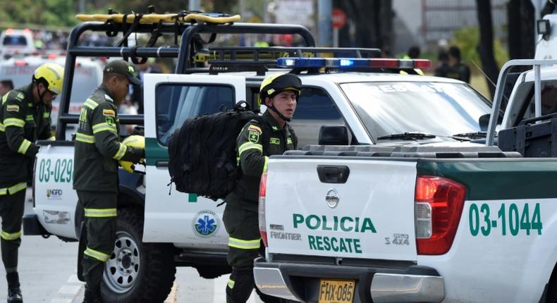 Security forces work at the site of a car bombing at a police cadet training school in Bogota