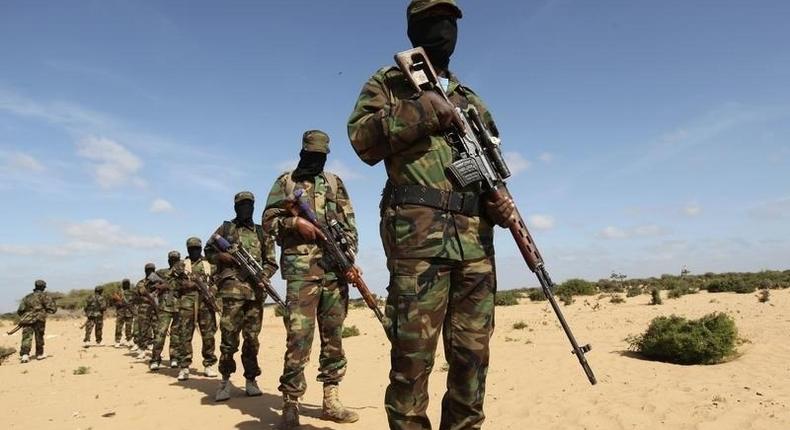 Members of Somalia's Al Shabaab militant group parade during a demonstration to announce their integration with al Qaeda, in Elasha, south of the capital Mogadishu February 13, 2012. REUTERS/Feisal Omar