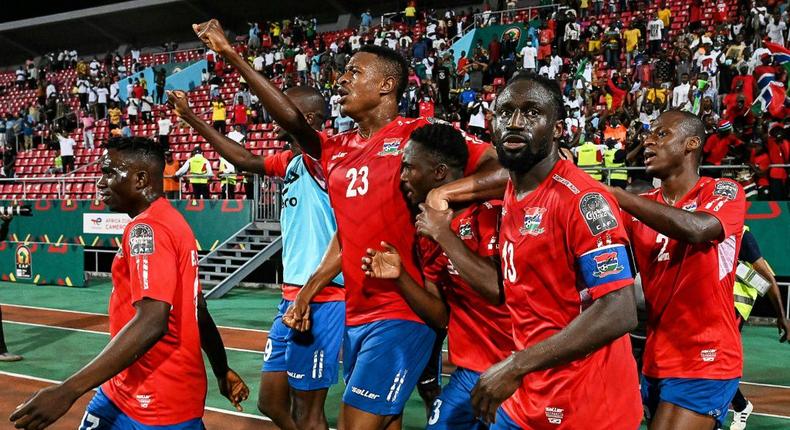 Gambia substitute Ablie Jallow (3R) celebrates with teammates after scoring the goal that beat Tunisia in an Africa Cup of Nations Group F match in Limbe on Thursday Creator: Issouf SANOGO