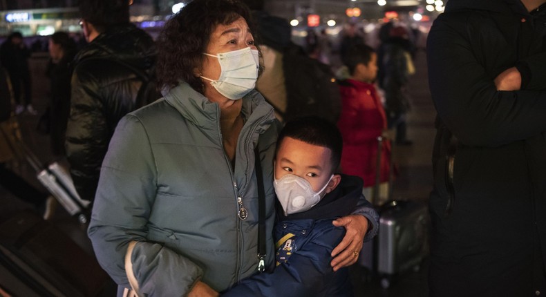 Chinese boy hugs relative amid coronavirus outbreak