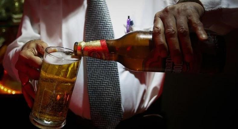 A bartender pours Haywards 5000 strong beer, a product of SABMiller in a file photo.  REUTERS/Danish Siddiqui