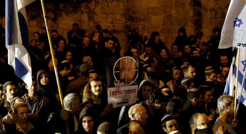 Right-wing Israelis, mostly from settlements in the occupied West Bank, protest outside the residence of Prime Minister Benjamin Netanyahu in Jerusalem