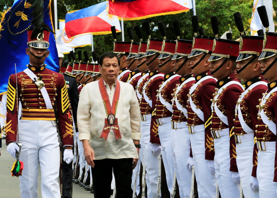 President Rodrigo Duterte reviews police-academy graduates at the Philippine National Police Academy (PNPA) graduation in Camp Castaneda, south of Manila, March 24, 2017.
