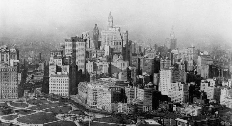 An aeriel view of downtown Manhattan from the 1920s features an elevated train track, a much wider Battery Park, and the South Ferry Terminal.FPG/Getty Images