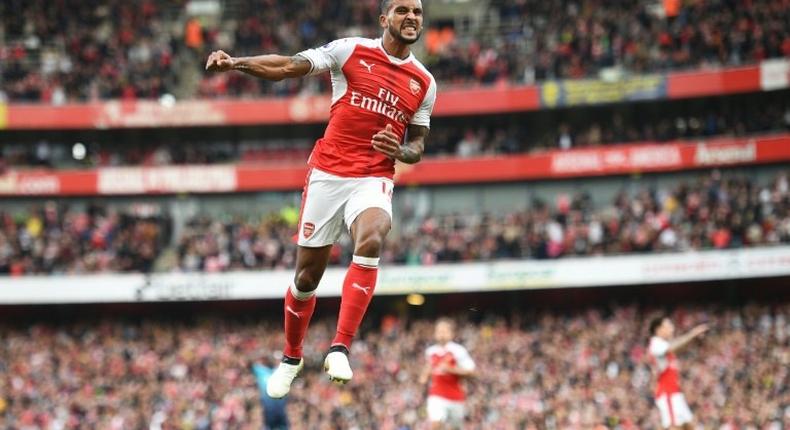 Theo Walcott celebrates after scoring Arsenal's second goal against Swansea City at the Emirates Stadium on October 15, 2016