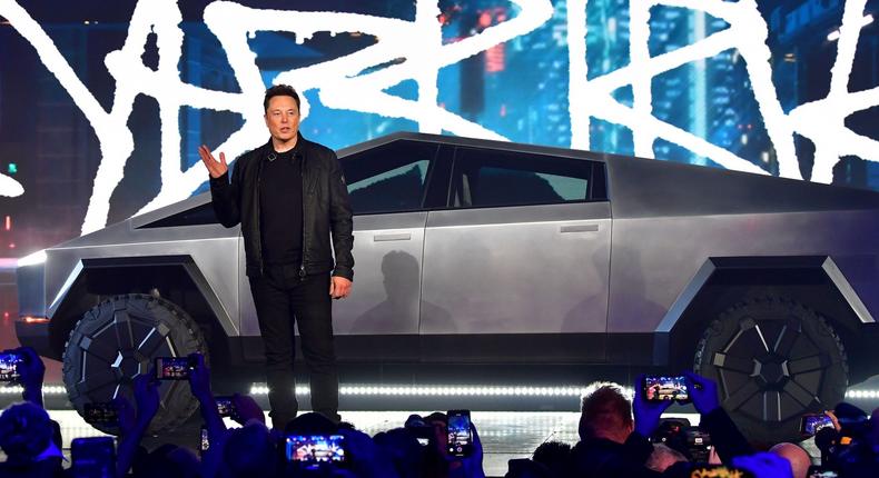 Tesla CEO Elon Musk stands in front of the Cybertruck during its unveiling on November 21, 2019.
