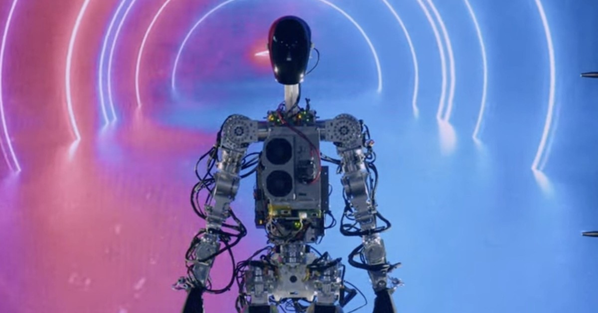 Tesla's humanoid robot Optimus waved and danced on stage at the company ...