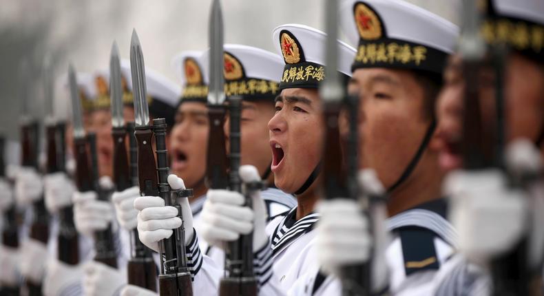 Chinese People's Liberation Army Navy recruits at a parade to mark the end of a semester at a military base of the North Sea Fleet, in Qingdao, China, in 2013.