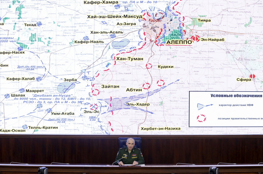 Lt. Gen. Sergei Rudskoi, chief of the Main Operational Directorate of the General Staff of the Russian Armed Forces, attends a news briefing with a map of Aleppo, Syria, and its surrounding areas in the background, in Moscow, Russia, on April 11.