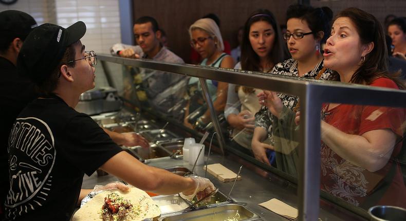 Chipotle has been accused of skimping out on portions. A robot won't be a viable solution, a restaurant analyst told BI.Joe Raedle/Getty Images