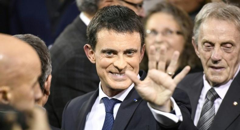 French Prime Minister Manuel Valls greets supporters after announcing his bid to become the Socialist presidential candidate in the 2017 presidential elections, at the town hall of Evry