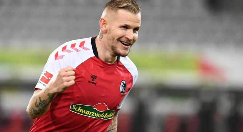 Handed a win: Freiburg's Jonathan Schmid celebrated after scoring as Freiburg beat Borussia Dortmund