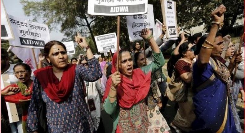 Activists seen protesting the rape outside a police station