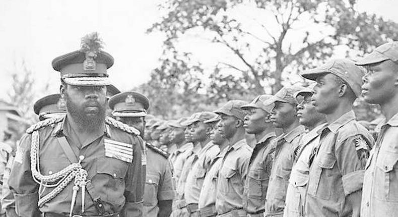 Chukwuemeka Odumegwu Ojukwu, Biafra Head of State inspecting a parade