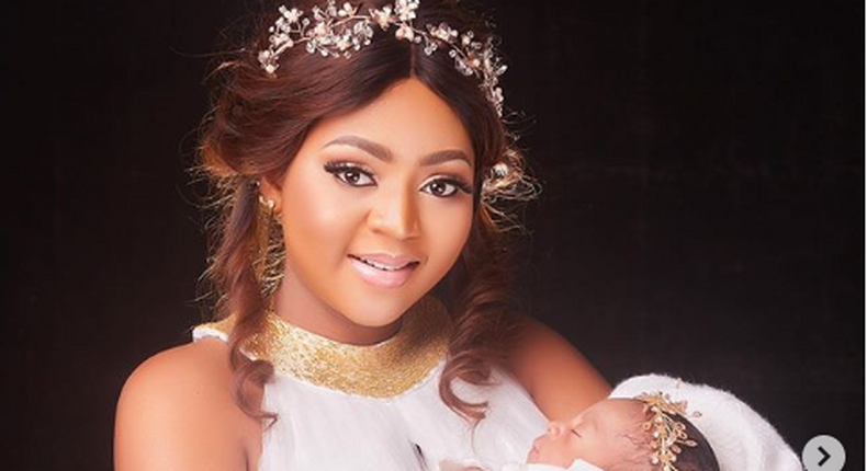 Regina Daniels and her baby 